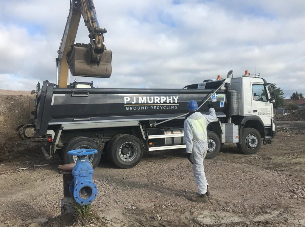 P J Murphy Ground Recycling 8-wheel Volvo tipper truck being loaded by a Caterpillar digger with fully trained driver all for hire